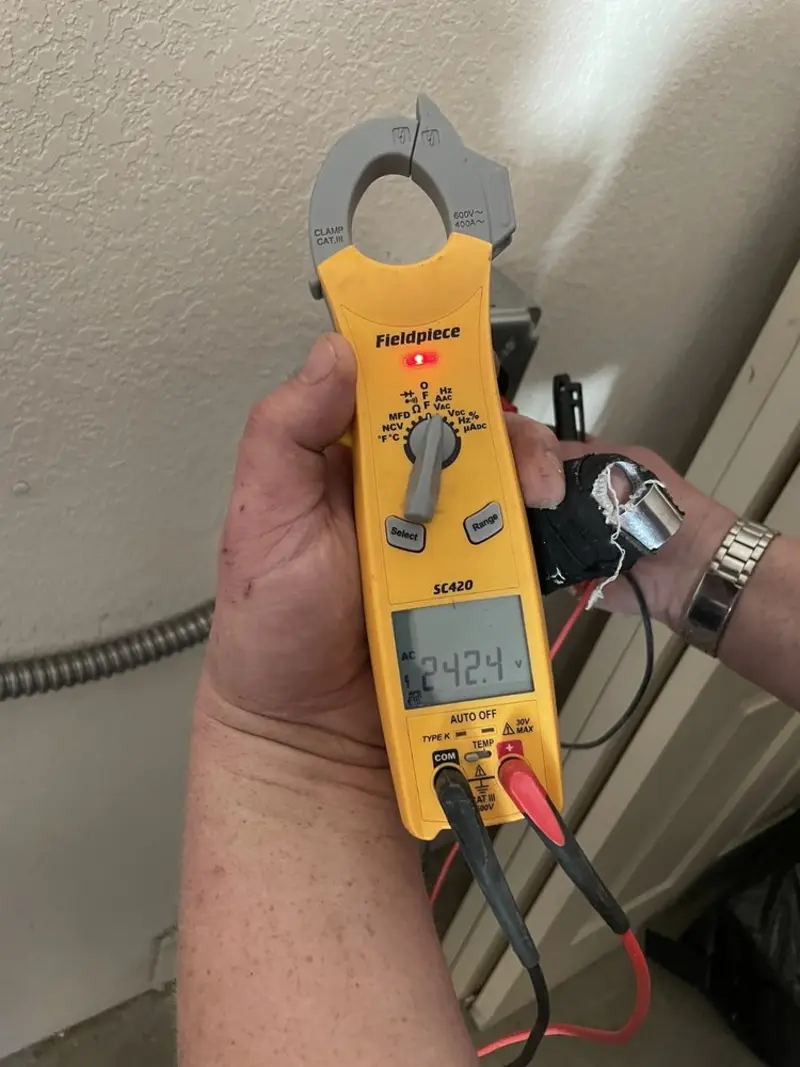 Voltage testing with clamp meter during Electrical Installation Services in Shepherdsville